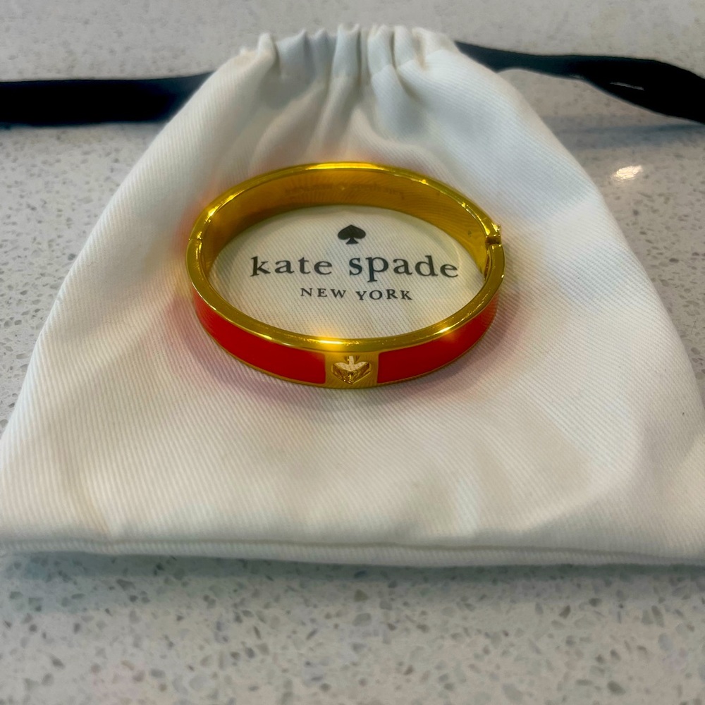 Kate Spade Pink Spade Cutout Bangle. Pink with gold tone trim.